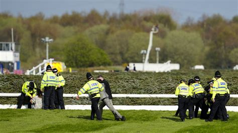 More than 100 arrested as activists delay Grand National
